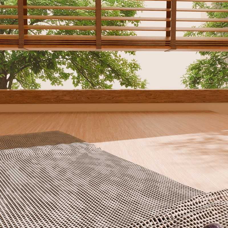 An empty sunlit wooden tabletop with window blinds.